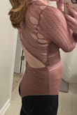 I was super disappointed in this purchase. I bought this bodysuit to wear to my friend's birthday. I hadn't even worn it yet and the first time I put it on all these holes occurred all down the right side while I was getting ready! The left side also had a couple of smaller holes by the time I was done. I decided to still wear it out since my hair could cover it a little and I didn't want it to go to waste. Since I was wearing a sticky bra with it, I was a little fearful that the whole thing could just rip across, and then a part would fall off. Thankfully that didn't happen, but super sad it ripped only after one time of wearing and not even while out yet...also got a hole on the end of the sleeve while I was having dinner. Put it on again just to take these pics. - Dana W.