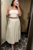 Love this skirt. I wore it with the matching top which is cut slightly odd.  My daughter paired it with a top from one of the other outfits.  Both fit a little loose at the waist. - Amy A.