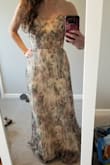 I had my eye on this dress for a while and felt like I had to have it. It is the most gorgeous dress and my only problem is I feel like I need a super special occasion to wear it. Never trusted wearing strapless dresses much, but with the corset bodice and ties, it definitely can't go anywhere. Seems like it was meant for shorter torsos, which I have. It is very long and I will have to get it hemmed at least a few inches. Highly recommend it, it's so pretty! - Meghan L.