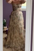 It's very flattering and such a beautiful print. Runs really long but true to size. - Coleen N.