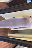 This will be great for a spring/summer wedding! It's a great quality and color. I'm typically a size small, but based on reviews I ordered an XS. It fits, but I would have liked a little more breathing room. However, if I went a size up, I think the strap would have been too loose. - Taylor L.