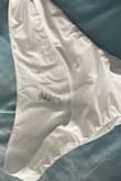 I did not even get what I ordered for this bikini top. I ordered the poolside ruffled bikini top, but instead, I got a large white bikini bottom that I didn't even order. Could I please get what I ordered? Thanks - Elise J.