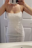 I tried on tons of dresses at the bridal salons but couldn't justify spending 3k+ on a dress that I was only going to wear for a couple of hours (were eloping and have 3 hours of photography) I stumbled upon this dress when I was looking on the site for a dress for engagement photos. I was pretty nervous about ordering a dress online especially being in Canada, I heard a lot of stories about girls paying a ton for duty. I spent like $240USD and only paid $56 CAD in duty and I'm so glad I decided to order it!!! It's beautiful and high quality, heavy but in a good way comparable to the dresses I tried at the bridal store, I would easily guess this dress to be $1500 minimum. Not see-through at all, beautiful lace and train and doesn't need any alterations! I didn't cry once at the bridal store trying on tens of super expensive dresses but when this was delivered I cried big time!! I used the size finder and it was super accurate. If you're on the fence just order it!!! Everyone I showed can't believe the price. - Jessica D.