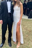 My daughter wore this dress to her junior prom. It was a stunning dress and fit her like a glove. She wore an xxs. She's 5'7 (slim - maybe 100 lbs) and the hem hit at the top of her shoe, which was perfect. I was happy we didn't have to alter it. She was very comfortable in the dress - could move easily - dance, etc. She wasn't tripping on it or having to pick up the "train" like a lot of the other dresses we saw. The dress was well made and was even prettier in the dim setting when lights hit it - it sparkled. Tasteful, comfortable, beautiful dress. Would definitely recommend! - Kim Y.