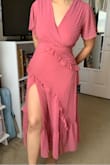 Wore this piece for a wedding in the countryside. It's comfy & flowy. Has a slit on the side that is pretty high but gives a cute touch. If you're self-conscious about long slits or showing some cleavage I'd pass on this one. Snug in the waistline but no issues otherwise. Fit me like a glove. Would recommend! - Chelsea C.