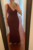 I have this dress in navy blue as well and I must say I love both but this color is beautiful. Not exactly "purple" but not exactly "burgundy" either. It has a decent weight to it and is lined. I am 5ft9 about 180 lbs and I wear 3.5 inch heels and that is how far it came to the floor on me. I have wide hips and a small-ish chest but my self-conscious area is my stomach. I took this selfie with no spanx on and I must say that I am considering not wearing them either. It is really comfortable and I can't wait to wear it to one of two weddings I am attending! - Jessica W.