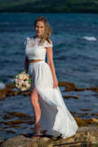Loved this dress for my beach wedding. I ordered size XS. Had to alter it but only to make it shorter. Otherwise, it's true to size. - Alina C.