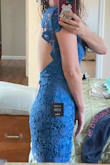 Beautiful dress but the fabric is very stiff (no stretch at all).  My biggest critique is this dress needs built-in breast cups. The open back is gorgeous but you can not wear a bra. I love the color, it's perfect for a spring wedding. It also is a little longer in length than some of the other dresses I've bought on Lulus, which is nice when you want to be more formal. - Brie S.