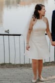 I was looking for a short wedding dress and I found this one online. I never ordered any clothes online, so I was really worried about it because it sounded too good for this price and I did not know how much the duty would be when I order them in Hungary and how long it will take. The shipping was super fast, it was here within a week, and the duty was higher than I expected, almost as much as the dress itself but anyway, it was totally worth it! I wore it at my wedding, loved it and got a lot of compliments! The fit is very nice, the material is very good quality, not at all see-through, comfortable and the lace is very nice. I can only recommend it! - Vilja A.
