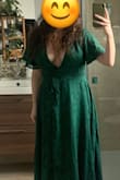 This dress is nice! The green color is pretty bright. The fabric is okay, but I was not crazy about it. I should have gone with a large instead (I have a large ribcage and it was a little tight). 
I didn't exchange because of the décolleté (which is really deep). I wouldn't have felt comfortable at a wedding. - Jade L.