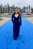 The dress is gorgeous but it was too long for me. I paid extra to get it tailored to my height. I ordered size XS and it was too snug in the bust area. I adjusted it with a safety pin. I really loved the dress but I would have loved if it came in petite sizes. - Maria M.