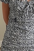 My first time ordering from Lulus and my daughter wanted this dress for her 8th grade promotion. She loved it and took the tags off before realizing there was a hole at the seam of the outer mesh netting that rendered the adorable dress useless. 

Poor quality and cheap material made this one too good to be true. Very disappointed. - Korinna D.