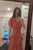 I really like the dusty rose color and the length. I'm barely 5'4 and this dress hits me right above my ankles. I don't feel that the slits are that high. I got a xxs and it is slightly big around my waist and hips. Yes, the bust area is big but it's not a big deal. I'm contemplating on whether to keep this dress or not... I originally bought this dress for an engagement photoshoot but since it's quite loose, I don't know how it will photograph. As for the quality, I would say it's pretty fair. There are some undone threads on the side zipper that gets stuck in the zipper. - Miso C.