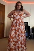 This dress is SO summery. I usually am either a L or XL and wish i got a large because it is a little big on me. It isn't too long either! Either way I am obsessed with it! - Sarah S.