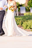 I cannot say enough about this gorgeous dress. It was everything I wanted in a dress for a small wedding. I received so many compliments on this dress and everyone was shocked when I told them it wasn't from a bridal store and how much it cost. I did need it to be hemmed as I was stepping on the bottom while wearing heels. - Katie B.
