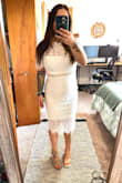 When I opened the dress it looked very small. I ordered a medium like my usual size but it did fit perfectly. It has a little stretch to it. I did think the dress was very cheaply made. They didn't trim it properly with loose thread and a thin under layer. But overall I really liked the dress. I got this for my bridal shower. I tried on 3 others from different places and this one was the winner. Even though I thought the under layer was thin it did conceal everything. Overall great dress just didn't think it was worth the price or should have been better quality for the price. - Ashley D.
