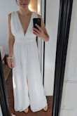 I want to live in this jumpsuit - it's so comfortable but also flattering! I have a long torso and it's long enough for me. There's a lot of fabric in the top but it works. I am getting it hemmed 3-4" so the pants run long but it's worth it. - Ashley D.