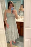I originally ordered this to wear as a guest to a friend's wedding. I absolutely fell in love with it! The fit of this dress was even better than I had hoped and I loved it even more in person once I received it and tried it on. I really like that the straps tie and can be adjustable too. I loved the dress so much that I even went back and ordered it in white for my own wedding rehearsal in May. However, I was sent the wrong dress the second time around due to the packaging being mislabeled, and now it's out of stock so I am very disappointed and not sure if I'll get the correct dress in time for my rehearsal. :'( - Emily C.