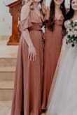 Wore this as a bridemaid dress. Was very comfortable and light. It has a clasp in the front so you can decide how much cleavage you want. The color flattered everyone. - Clare B.