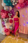 I'm not typically someone who shows my stomach, but I loved the look of this two-piece set and I'm so glad I went for it! I got so many compliments on it. The material has a nice stretch which I loved because I have muscular legs and I was able to feel comfortable in it. It shows just enough while still being very classy and the color is so fun!! I got it for a bachelorette party in Miami, but I can see myself wearing it many more times. I was also pleasantly surprised with the quality for such an affordable price point. This was my first Lulus purchase and it definitely won't be my last! - Courtney V.