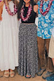 Beautiful flowy skirt. The slit can be adjusted with buttons however high or low you want. A couple of the stitching seams have come undone which is a bummer since I've only worn it once. I wore Chacos with it and it just grazed the floor. - Ella L.