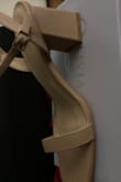 As you can see by the photos, there are two labels on the shoe box! Indiyah Black Suede Strappy Sandals is what I ordered..Ugly Camel PU is what I received! So who stuck the label for what I ordered onto the Camel PU box and thought it was ok to send me this??! HOW, WHY, WHO!! Send me what I ordered and paid for! What kind of scam is this?? - Yolanda B.