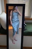 This dress was very cute, but the top layer laid a little strange on me. The back was not for me either. I think it would look/feel better on someone else! - Megan C.