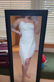 This dress is SO comfortable. There's a little bit of rubber to help keep the dress up. The top is a little big on me, but with a bra, I think it will be perfect. I plan on wearing this for my bachelorette party! - Megan C.