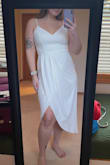 I have this dress in dark green (size small) and white (size large). I absolutely love it. It is tight and flowy in all the right places. It's super comfortable & the chest is secure so I won't be worried about falling out. I plan on wearing the white for my bridal shower! - Megan C.