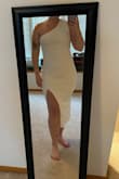 This was my favorite white dress I have tried on from this store! It is so pretty & flattering. The strap is thick & secure. The fabric is soft & comfortable also. I plan on wearing this one for my rehearsal dinner! - Megan C.