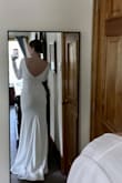 This is my dress! It's everything I was looking for with the perfect price tag! It is simple and classy and elegant and sexy all at the same time! I will add cups (excuse my lack of in the pictures!) and shorten the sleeves and length a tiny bit, but these are simple and inexpensive alterations. I cannot wait to marry the man of my dreams in my dream dress! - Cathon L.