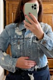 I really loved the style of this jacket but found it much too large for me. I typically wear a medium in most Lulus dresses, but I like my denim jackets to be a bit more fitted (otherwise I look too boxy), so I specifically ordered a size small in this jacket to account for that. Even with a small, it was still too large and boxy on me. I could still fully button the jacket with room to spare, and the arms of the jacket were very boxy/wide cut in addition to the collar being wider than a normal denim jacket. I would have exchanged it for a XS if I could, but the sizing only goes to S. That said, I think the crop and distressing were great and overall quality for the price was just right. - Ashley L.