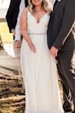 I absolutely loved this dress for our small intimate outdoor wedding. Extremely comfortable and I received many compliments. Being short I knew I'd have to alter the length and take up the straps. I did this and also had the pockets removed since you could see the lining of them. I also had a few stitches put in so the slit in the front wouldn't fly open in the wind and expose more than I'd like, it's front and center and goes allll the way up. I added a belt for a little something extra as well. Even with the cost of alterations, it's still a steal for a wedding dress, and people can't believe I ordered it online. - Jessica C.