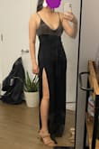 Bought this to wear on a night out with friends, but our plans got cancelled...Excited to wear this our next night out!
The material has some stretch, and there's a bow in the middle, so it hides any belly. The leg slits are VERY high! When sitting down, my legs are very exposed, but you can just pull the bottom part of the pants over, so it covers everything. It's pretty long, even with high heels or wedges, but manageable. - Elizabeth K.