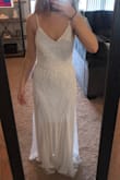 I really loved this dress, but it does run a bit large. It's a bit large in the bust and I would recommend changing the straps to add more support because the dress is a bit heavy. The beading is absolutely gorgeous and unique. Overall, it's an amazing dress for the price. - Madeline S.