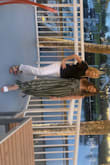 The jumpsuit is cute but deff on the large side and extra flowy. Good for comfortable wear. - Alicia