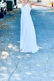This dress is gorgeous and overall made of high quality. It ran a little long for me but kicked out just enough with heels.  The spaghetti straps are delicate but strong.

I wore this dress for my beach elopement and it looks great in the photos! It doesn't have a train but the extra length flowed with the wind and made the dress look full. 

Highly recommend for an affordable summer wedding dress. - Kayla B.