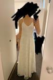 For a backyard wedding and low budget, this dress was great because the sequin embroidery makes the whole dress look very luxurious. 

The neckline and adjustable back straps are a pro and con: it allows you to tighten to whatever fit you desire, but you'll need to get a good backless nude bra to give support as this dress has no padding. The design reveals a lot of neckline and back, more than I would like to for a modest look, so you can pair it with a shawl or bolero if you prefer to cover up more. 

I am normally a size 4 but got the XS because the S was a little loose. - Debbie H.