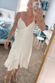 I've ordered other Lulus size small and they didn't fit in the chest but this one fits perfectly. Some wrap dresses are way too open and revealing but this provides perfect coverage and stays put. Love the flow of the fabric. Perfect for my second wedding. - Chantell T.