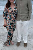 I wore this for a friend's wedding at the beach. The pant length was slightly long: I'm 5'6 and ordered a small. I wore flats since it was on the beach but a small heel would have helped slightly.
Comfy soft material, but it is a Onesie so remember that when you have to go to the bathroom :) there is a small button at the base of your neck to undo as well as the bow in the back.
Overall I loved it! - Shelby R.