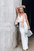 I love this romper so much! It has a modern, eye-catching style! It was exactly what I was looking for! Fit perfect! I got a M & it fit nice. I also love you can still wear a strapless bra with it & you can't see it! 
It's so beautiful!!! - Chelsea S.