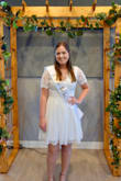 I LOVED this dress. I have a pear shaped body and my hips are pretty wide, but it covered everything in back and was very appropriate (had to be modest with my grandmas there lol). I wore this for my bridal shower, and loved it so much that I will be wearing it during my honeymoon too. Buy this dress! You will get so many compliments! - Brennan K.