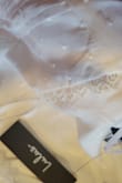 The dress arrived with pink marks on both sides of the collar. Unfortunately, I needed it for photos so I couldn't exchange for a new one. - Janelle H.