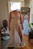 The fit is super flattering. It's true to size but pretty long. It's a tad more risque than I originally wanted so I'm considering adding a short lining and closing the slit a few inches. Hopefully, it'll be perfect for my mountain elopement. - Shanna T.