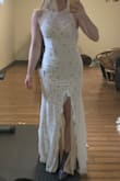 I got this dress in case I had complete wedding dress regret (I was teetering on the edge of it!) and I usually get XS in most Lulus things, but this one ran a tiny bit tight. I may have also been having some unusual weight gain at that time in which my waist was a bit bigger than usual, but whatever. Anyway, it's perfect. The length somehow works perfectly even though I'm short and the dress itself is gorgeous.
It was tight enough, however, that I probably wouldn't have been able to wear a bra or sticky boobs in it. And Spanx would be difficult too, probably - I reckon if I got bloated, you'd know immediately - Emily A.