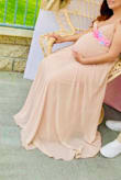 The dress is beautiful, perfect for pregnancy. I bought the pink blush and I loved it. - Ali L.