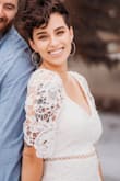 This dress is perfect. The length, the fit. There are not enough word to sing all the praise of this dress. It was fitting and comfortable. 
I didn't need to wear a slip or a bra. The laced fabric was thick and so detailed.
The price point was perfect.
So many compliments of the beauty of this dress! - Azia L.