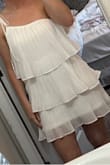 I haven't worn it out yet, so I'm including a photo in my bathroom mirror haha! I think this dress is so flattering for how flow-y it is. That's a hard combination to find. I plan on wearing this to my rehearsal dinner. I did order a size S even though I am a traditional M (size 6, 5'6, 145 pounds). The only thing I wish is that it was available with a little extra length - but I think for someone 5'4 and under the length would be perfect. - Lara L.