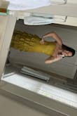 Fits me well! Love the color, especially with a tan. Wishing I also ordered the red one. Very fun. Need to steam but love the frills. - Lindsay F.