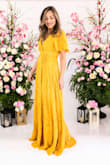 Ran long on me even with heels, but that was not a problem as I wore this dress for some family photos. The material is thicker so there is no concern of it being see-through. I felt so glamorous! - Rosa G.